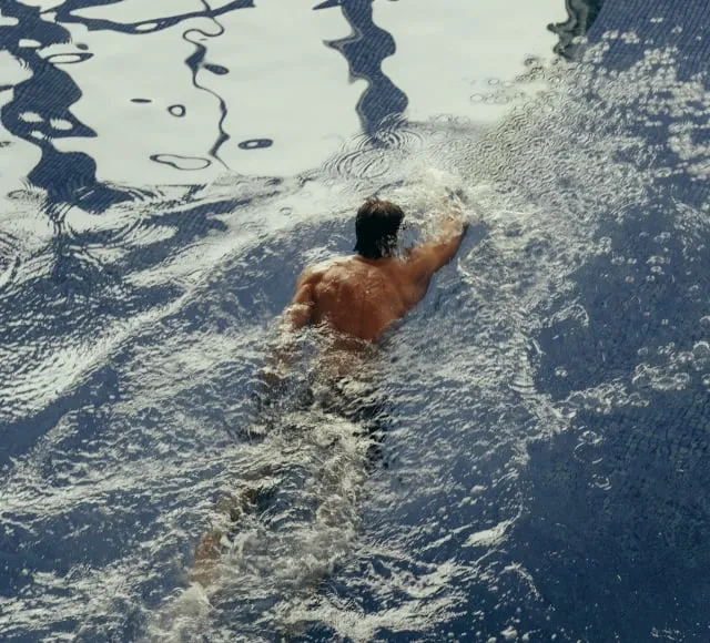 Person swimming lengths in the pool at the Cameron House Resort Health Club