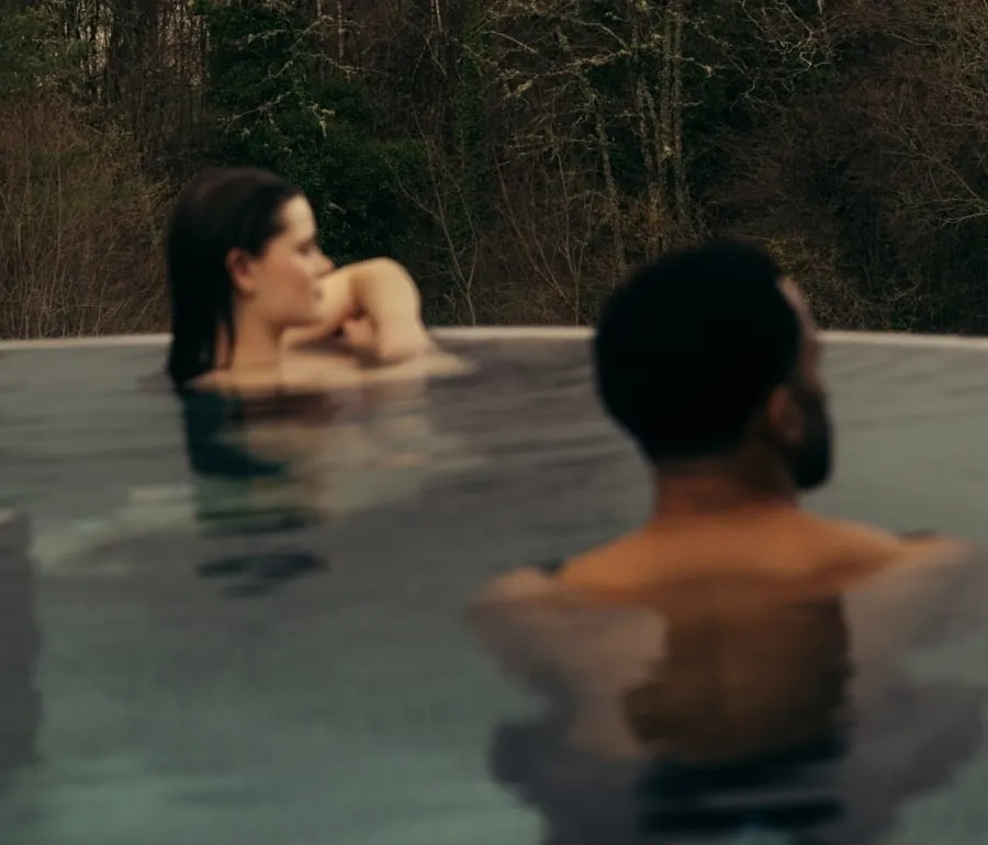 Couple in the rooftop pool at The Spa at The Carrick