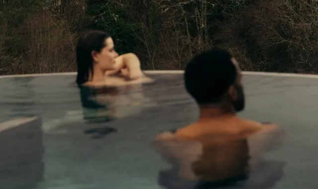 Couple in the rooftop pool at The Spa at The Carrick