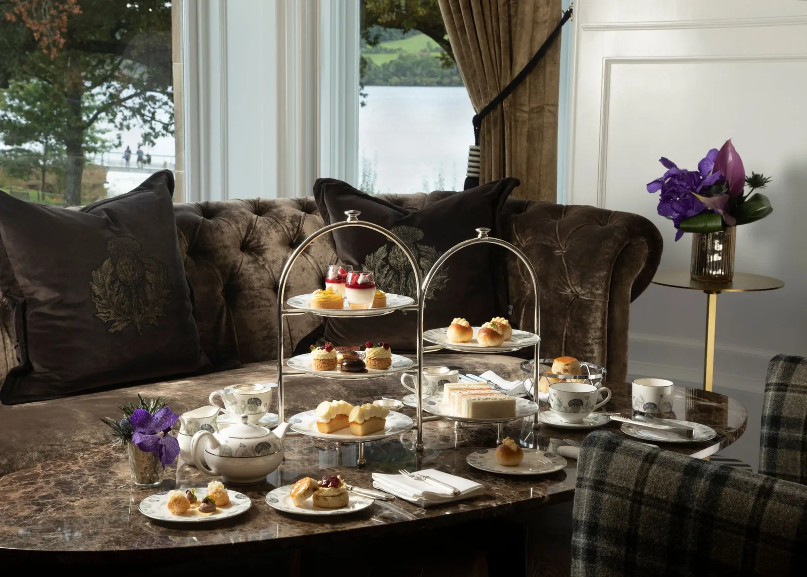 some food sitting on a table with comfortable sofas in the back