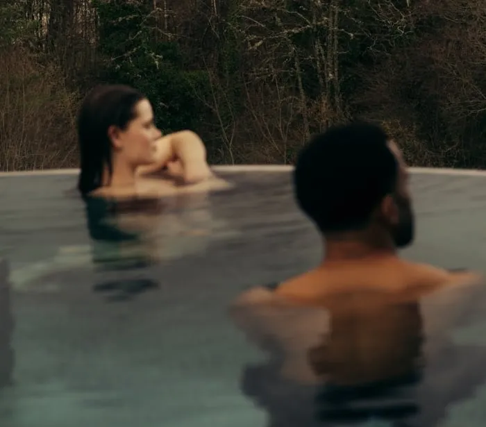 Couple in the rooftop pool at The Spa at The Carrick
