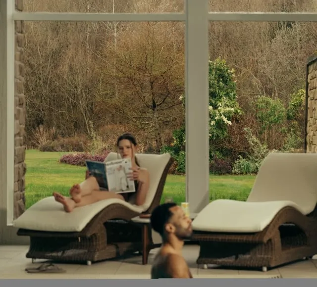 A couple relax in the Spa at The Carrick